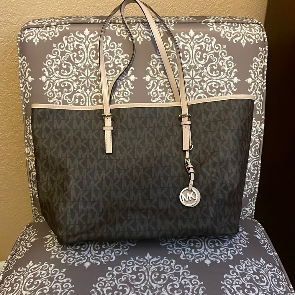 Michael Kors  Large tote w/ 2 straps.  Zip pocket inside  Brown signature MK’s